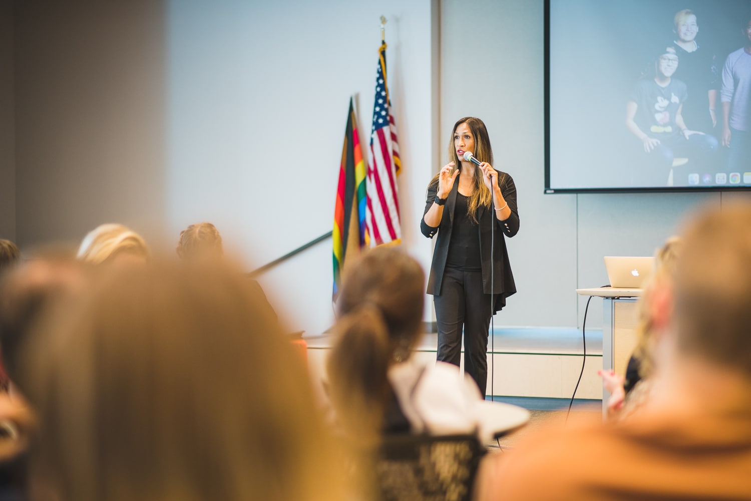 BEL presenter speaking to seated students