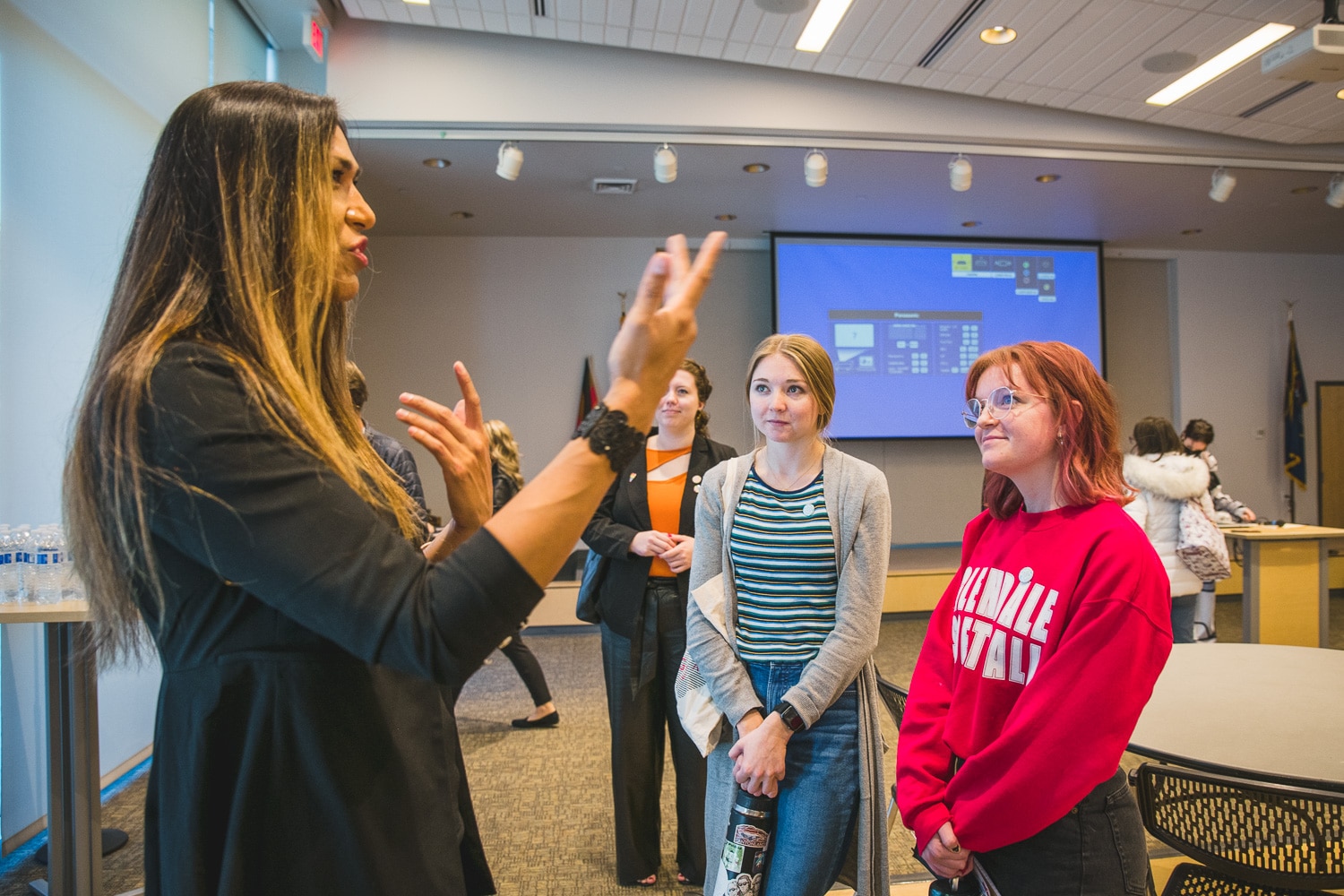 Instructor standing and explaining to students