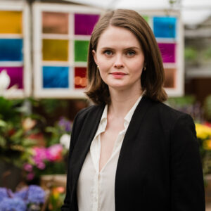 Headshot of Sahara Hayes outside in formal attire.