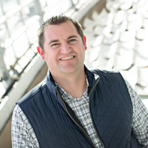 Headshot of Zach Robinson dressed in casual attire